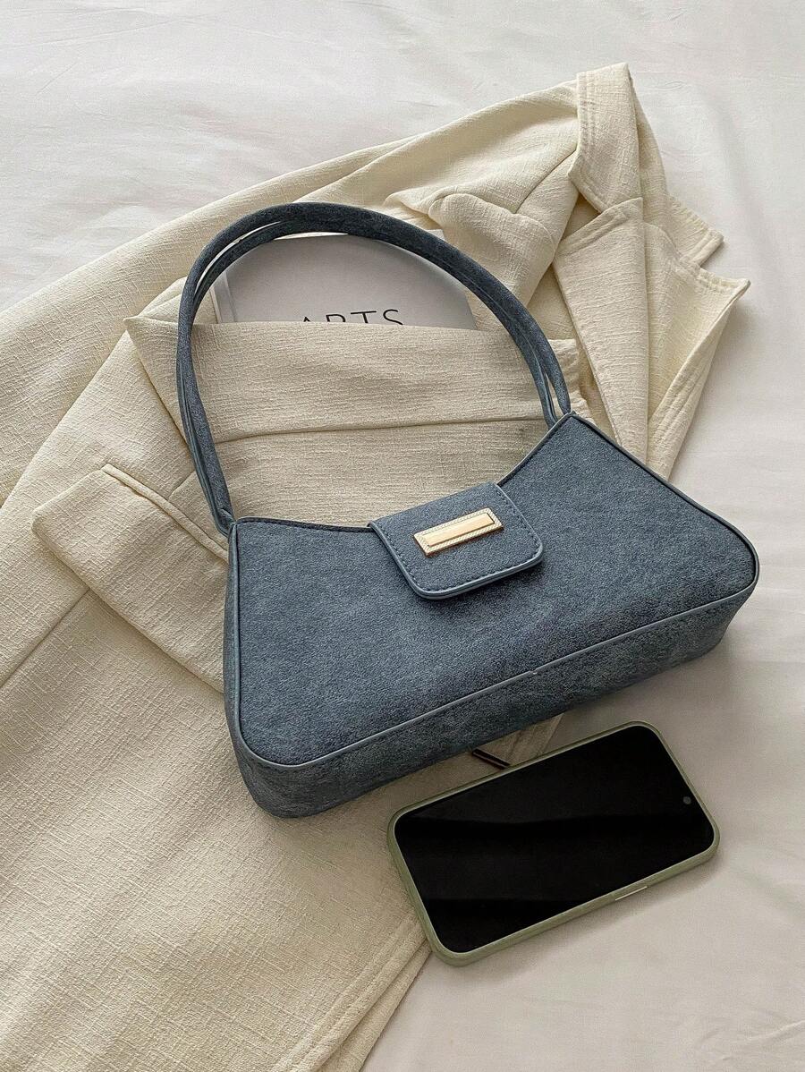 Sac à bandoulière en métal avec fermeture éclair et design épuré
