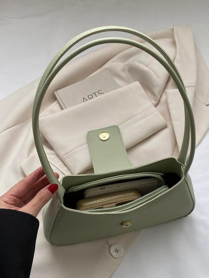 Sac à bandoulière en métal avec fermeture éclair et design épuré