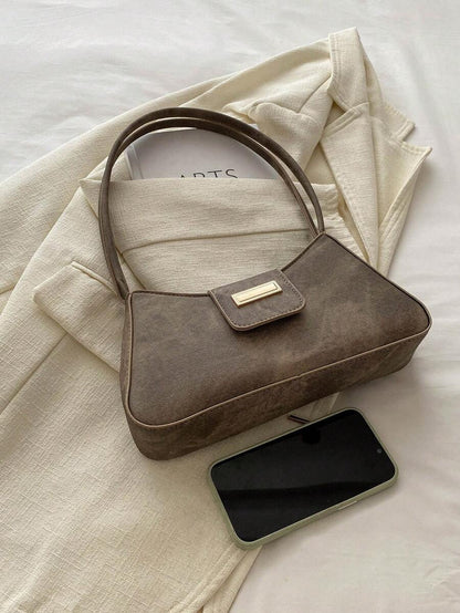 Sac à bandoulière en métal avec fermeture éclair et design épuré