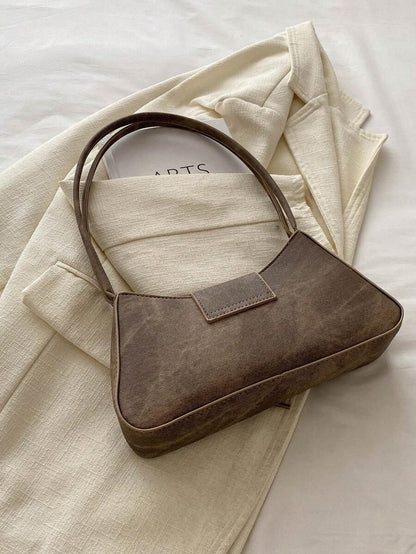 Sac à bandoulière en métal avec fermeture éclair et design épuré