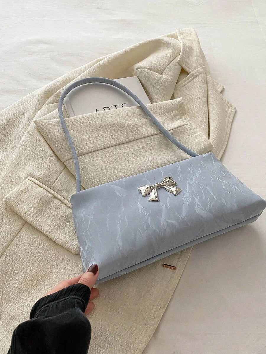 Sac sous le bras – Forme carrée, nœud décoratif, anse courte