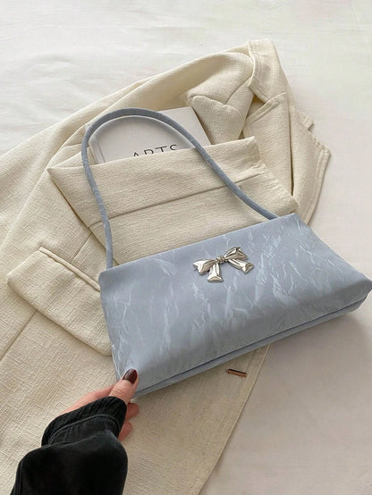 Sac sous le bras – Forme carrée, nœud décoratif, anse courte