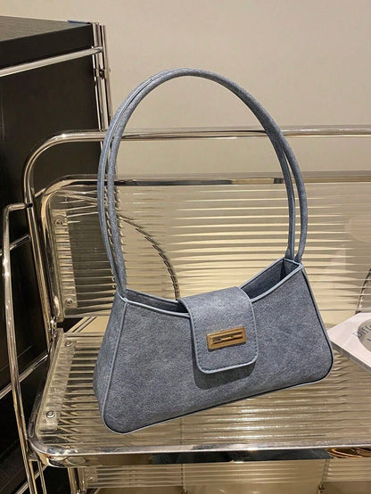 Sac à bandoulière en métal avec fermeture éclair et design épuré