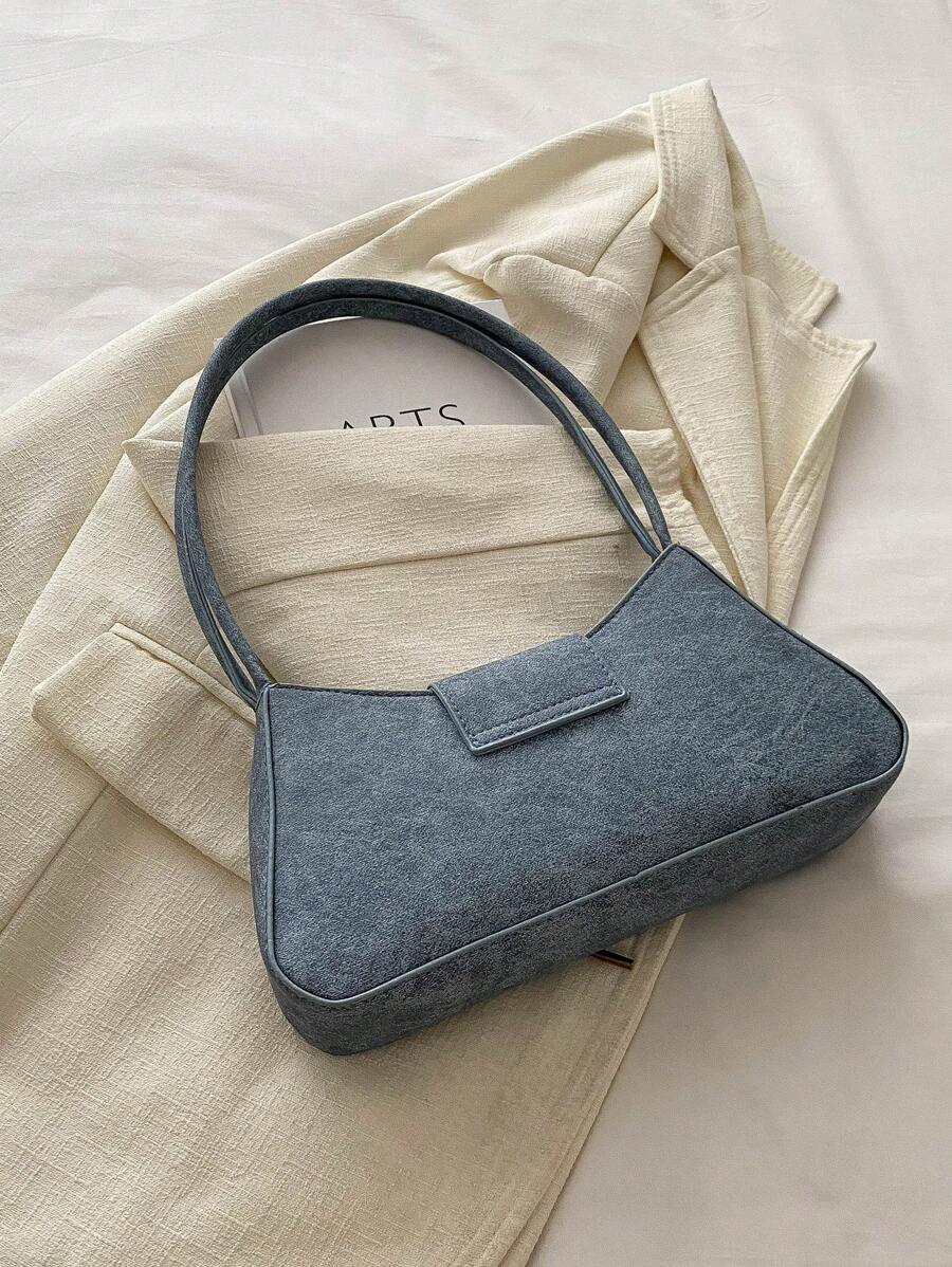 Sac à bandoulière en métal avec fermeture éclair et design épuré