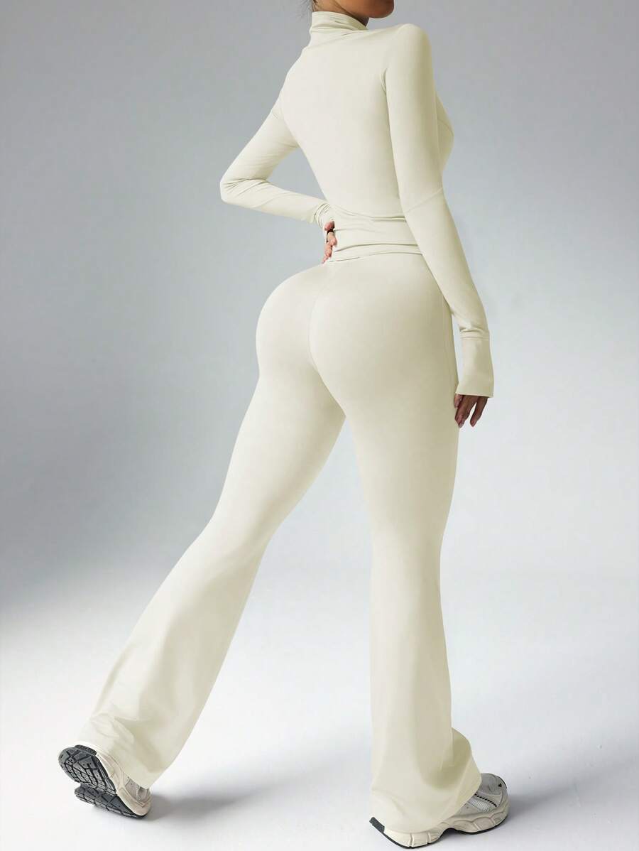 Dewbera – Ensemble de sport à manches longues et pantalon évasé, conçu pour le confort et la liberté de mouvement.