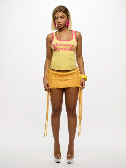 Sixtylia – Jupe mini en tricot à franges et liens latéraux