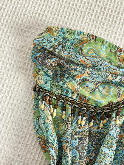 Flirla – Blouse en chiffon à lien taille unique et ourlet asymétrique
